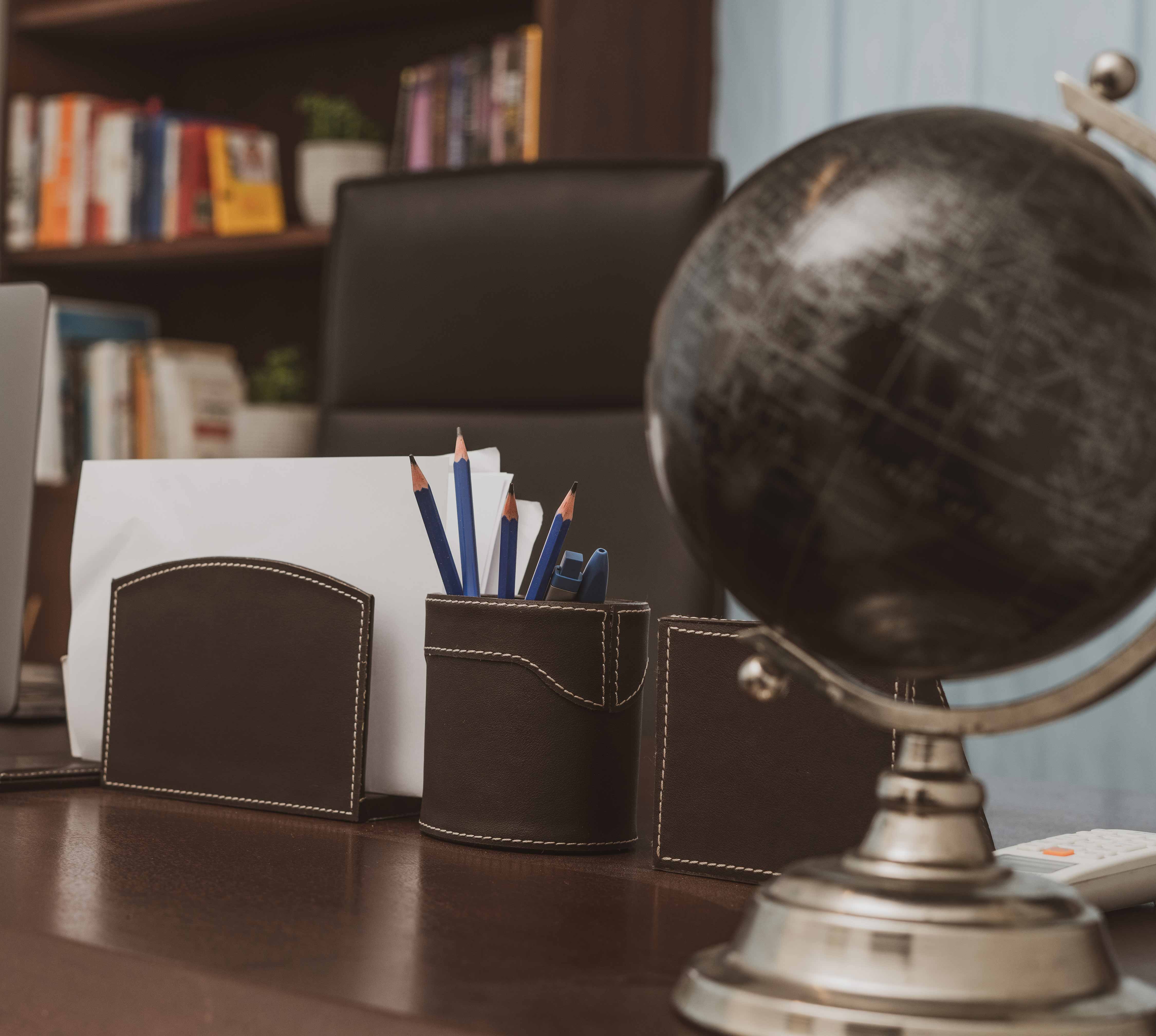 a desk with a lamp and a mirror