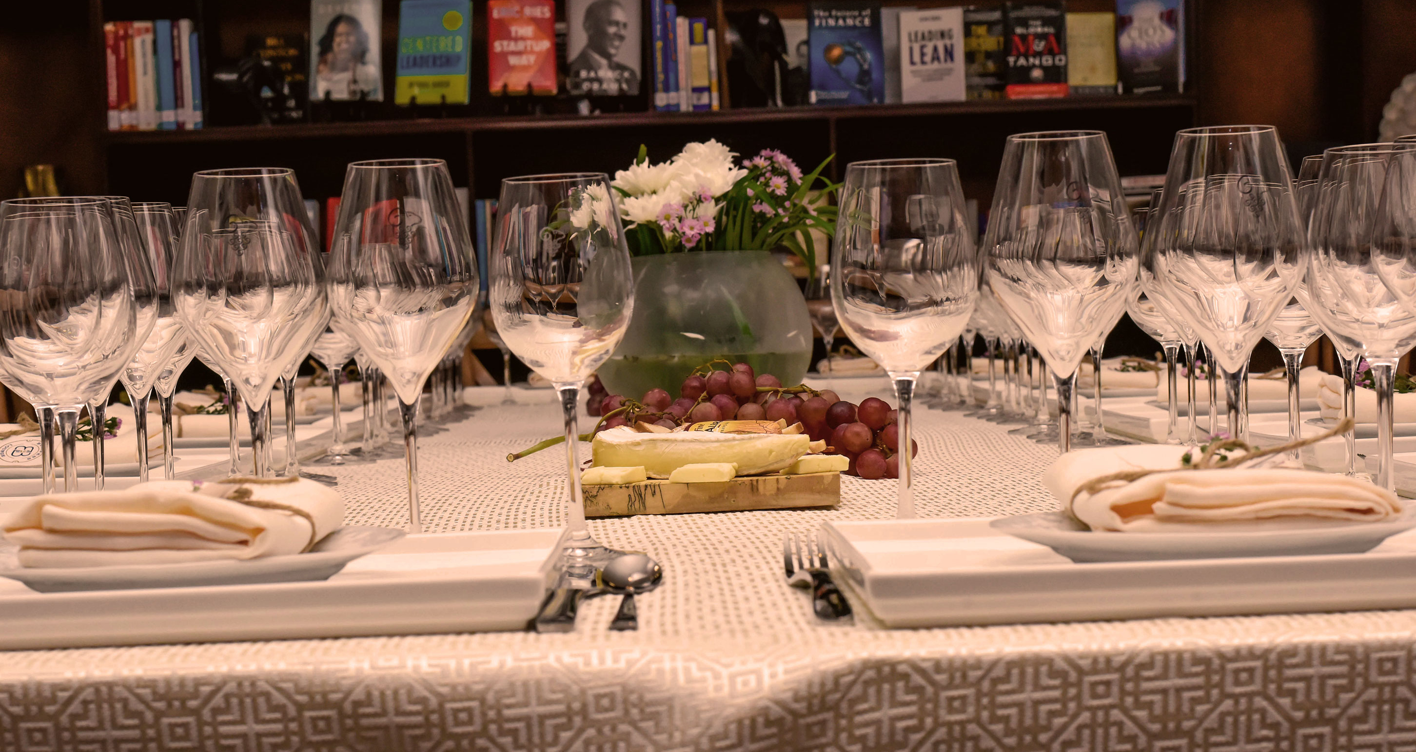 a table with glasses and a cake