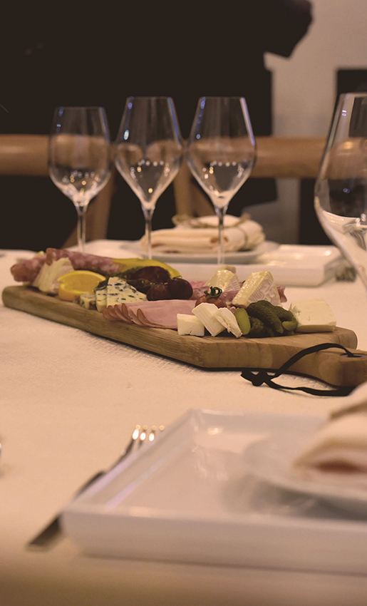 a plate of food and wine glasses